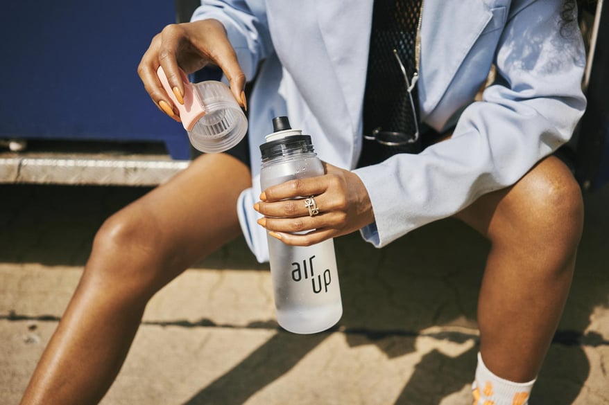 Woman holding air up bottle