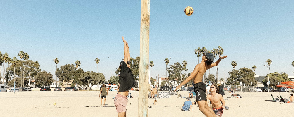 playing beach volleyball